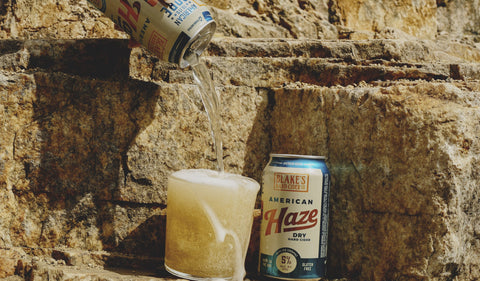 Blake's American Haze being poured into a glass on a sandstone ledge
